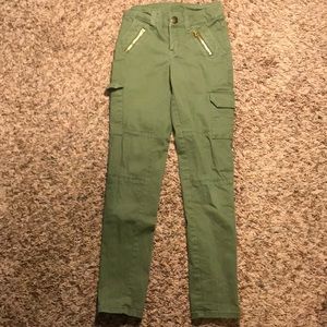Army green jeans with zipper and button pockets